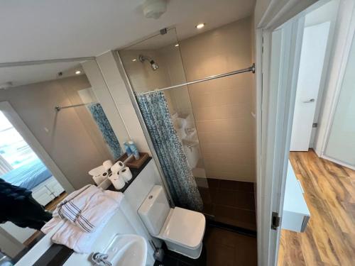 a bathroom with a sink and a shower at Spacious 2 Bedroom Flat Stunning Waterside View in Manchester