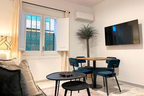 Televízia a/alebo spoločenská miestnosť v ubytovaní Genteel Home Baños