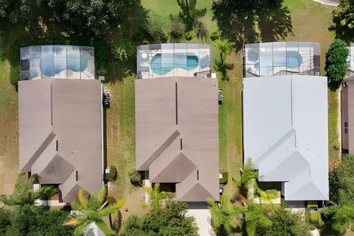 an overhead view of a house with three buildings at Quiet house with pool on a Top golf course in Haines City