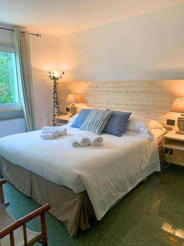 a bedroom with a large bed with towels on it at Amoredimare B&B in Villa in Polignano a Mare