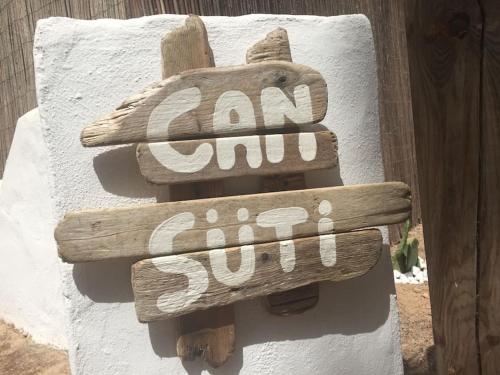 a sign that says am and sun on the side of a building at A beautiful villa close to the beach in Playa Migjorn