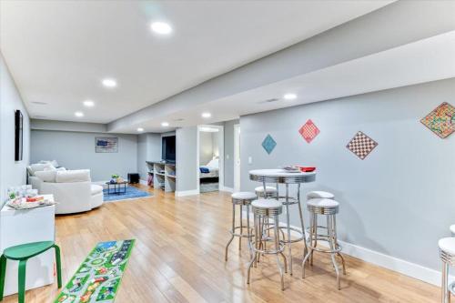 a living room with stools and a wall with kites at King Bed Modern Living Room Cozy Backdoor Patio in Salt Lake City