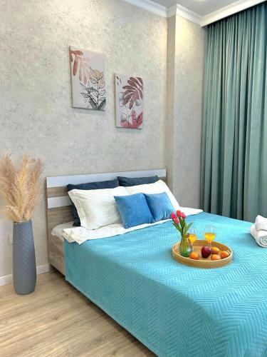 Postel nebo postele na pokoji v ubytování Уютная квартира на левом берегу Астаны