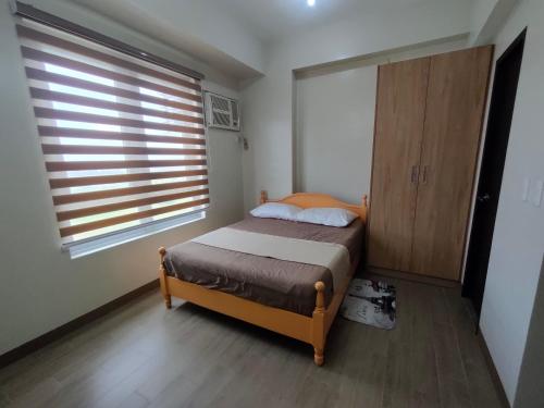 Postel nebo postele na pokoji v ubytování Refreshing Condo hotel