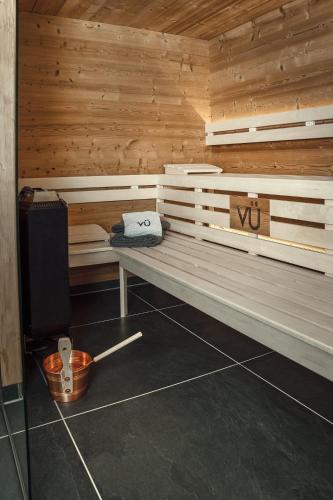 a sauna with a bench in a wooden room at VÜ Terrassen-Chalets in Münchberg