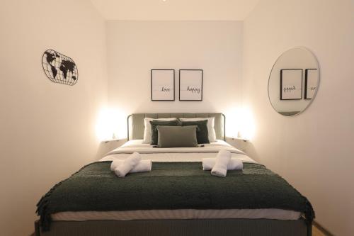 a bedroom with a large bed with two pillows at Emerald holiday home with patio in Vienna