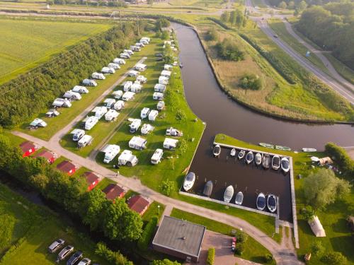 an aerial view of a parking lot next to a river at Camping Pasveer 