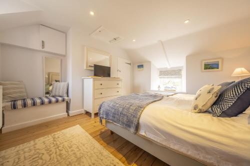 a bedroom with a large bed and a window at Seaview Cottage in Hunstanton