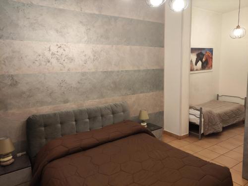 ヴィチェンツァにあるResidence San Miguel (centro storico)のベッドルーム1室(ベッド1台付)