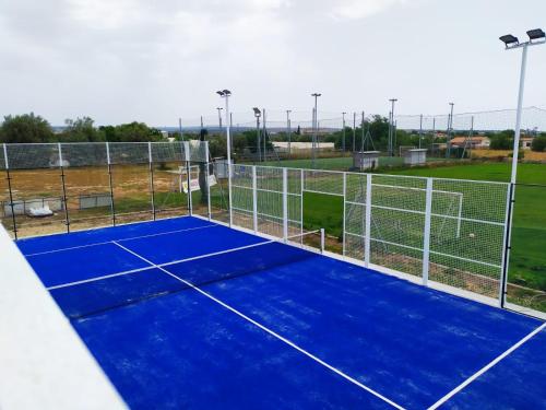 a tennis court with a net on a tennis court at L'Araucaria turismo rurale in Santa Croce Camerina