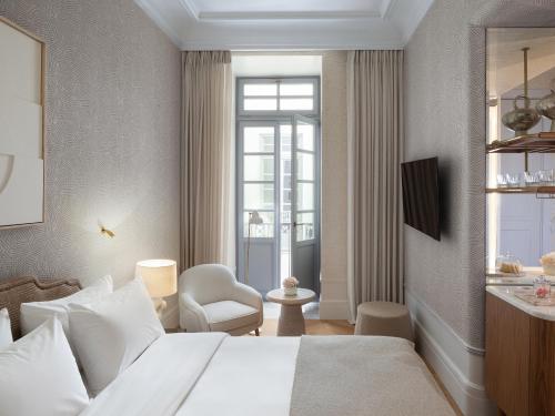 a hotel room with a bed and a window at The Dolli at Acropolis, A Hotel to Live in Athens