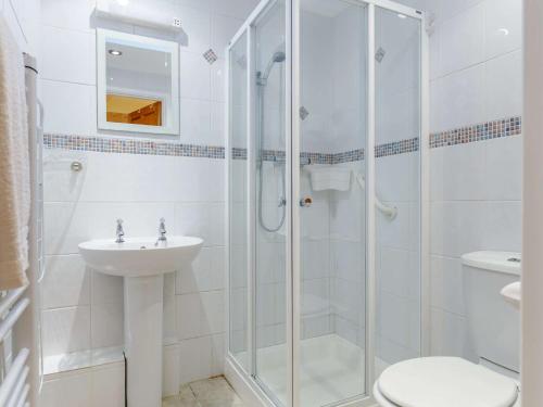 a bathroom with a shower and a sink and a toilet at 1 Bed in Constantine 85594 in Constantine