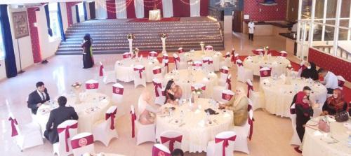 a group of people sitting at tables in a room at Sai Rock Beach Hotel & Spa in Bamburi