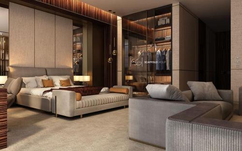 - un salon avec un lit et un canapé dans l'établissement Ron ban, à Dubaï
