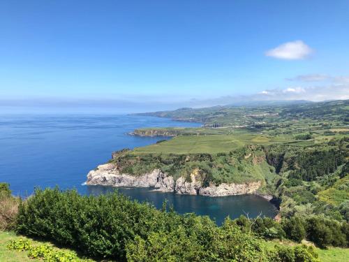 an aerial view of the ocean and a coastline at Alojamento CANTO NA RELVA in Ponta Delgada