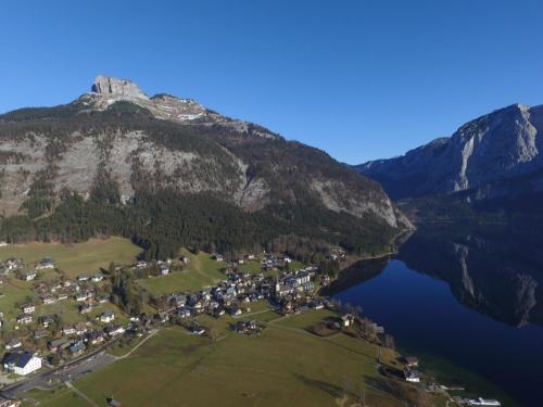 an aerial view of a mountain with a town and a lake at Heli's Holiday Suites, 8992 Altaussee, Suites "Dachstein", "Sarstein", "Trisselwand" in Altaussee