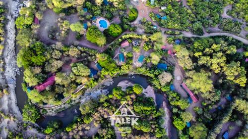 an overhead view of a park with trees and a house at Talek Bush Camp , Masai Mara in Talek