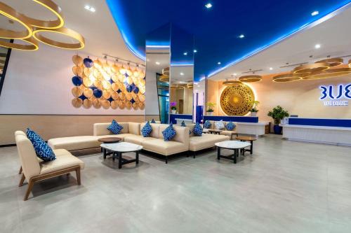 a lobby of a store with couches and tables at TUI BLUE Nha Trang in Nha Trang