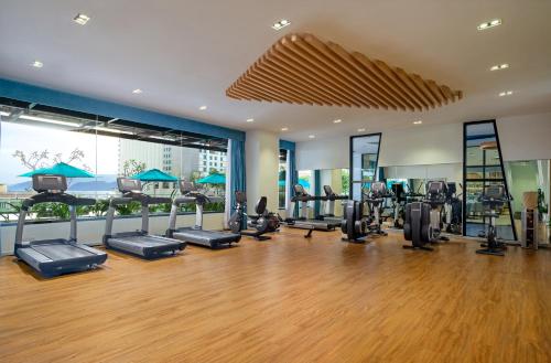 a gym with treadmills and ellipticals in a building at TUI BLUE Nha Trang in Nha Trang