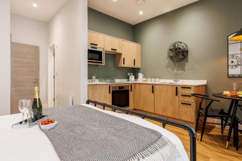 a kitchen with a bed and a table in a room at Sea Breeze - Coast in Bournemouth