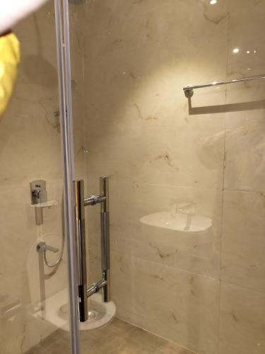 a bathroom with a shower and a sink at The VrindHuts in Vrindāvan