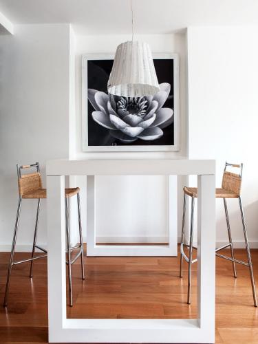 a white table with a picture of a flower on it at Casa Bevant Hotel Boutique in Buenos Aires