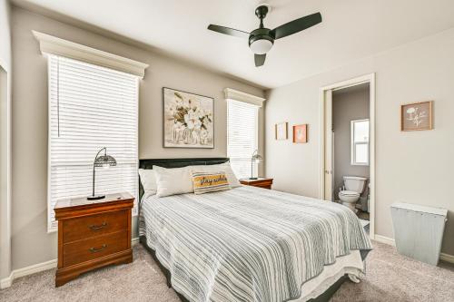 a bedroom with a bed and a ceiling fan at Yuma Home with Fire Pit and Outdoor Community Pool! in Yuma