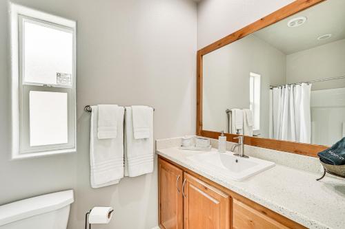 a bathroom with a sink and a mirror at Yuma Home with Fire Pit and Outdoor Community Pool! in Yuma