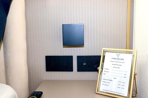 a sign sitting on top of a table in a room at Vittoria Parc Hotel in Bari