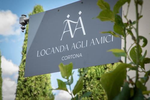 a sign for a laordaniaatalatal animal at Locanda agli Amici in Cortona