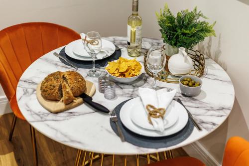 a white marble table with food on it at Sea Breeze - Coast in Bournemouth