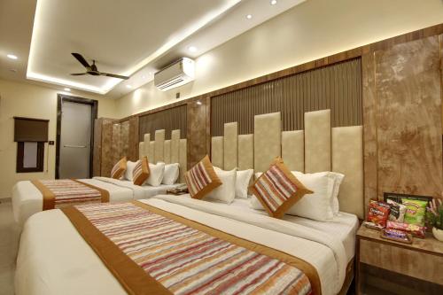 a hotel room with two beds in a room at BLESS INN - Near Connaught Place in New Delhi