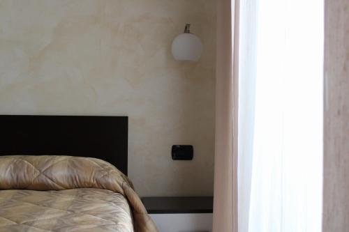 Кровать или кровати в номере Room and Breakfast Luciana Sant'Elia a Pianisi