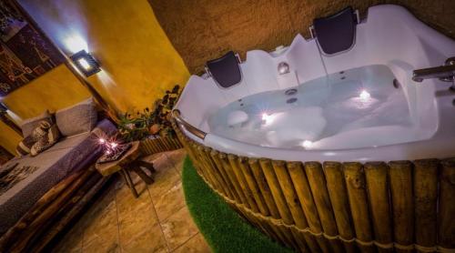 a bathroom with a jacuzzi tub with lights in it at Hotel Daytona Palace in Casoria