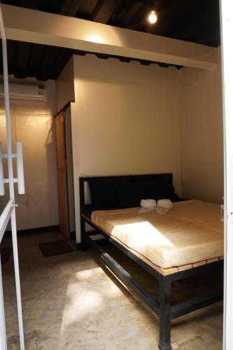 a bedroom with a bunk bed in a room at Canto Tièro Cabin 1 in Batangas City