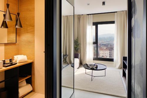 a room with a view of a living room at Nuvō Hotel Boutique in Oviedo