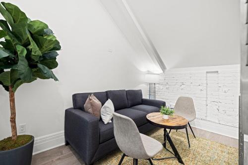 a living room with a couch and a table at Placemakr Dupont Circle in Washington