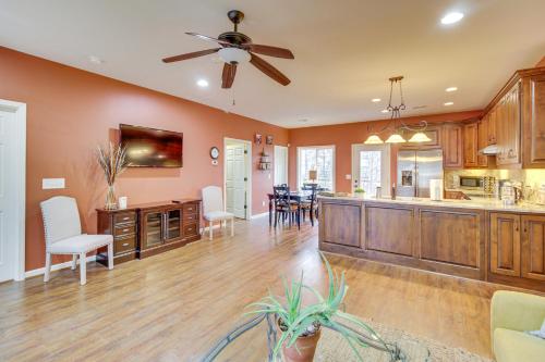 a kitchen and living room with a ceiling fan at Talking Rock Home with Private Deck in Jasper