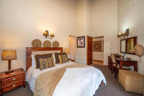 Kruger Park Lodge Unit No. 246にあるベッド