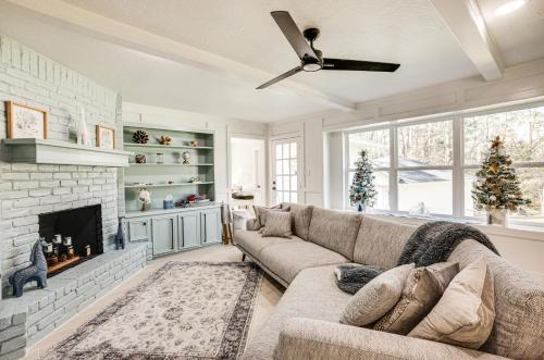 a living room with a couch and a fireplace at Quiet Texas Vacation Rental about 5 Mi to Lake Conroe! in Conroe