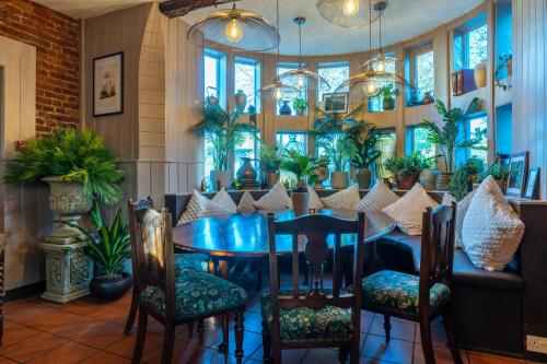 a dining room with a table and chairs at Woolpack Inn in Canterbury