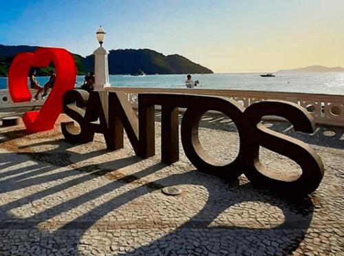 a sign that says s end on a beach at Apartamento em Santos in Santos