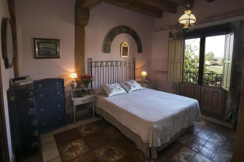 Ένα ή περισσότερα κρεβάτια σε δωμάτιο στο Hotel BOUTIQUE HOCES DEL DURATON