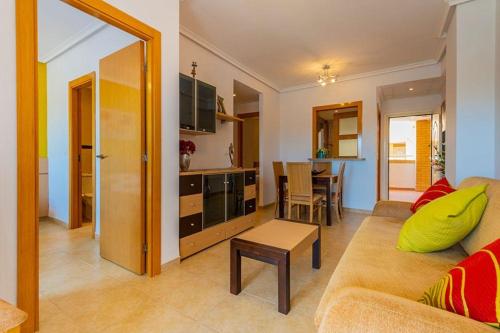 a living room with a couch and a table at Valparaiso8 in Oropesa del Mar