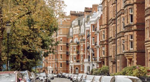 a row of cars parked on a street with buildings at London Chelsea 2 People Balcony Best Location in London