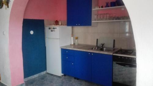 Kuchyň nebo kuchyňský kout v ubytování Apartmani Ivan