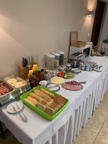 a long white table with food on it at Penzión U nás in Oravský Podzámok