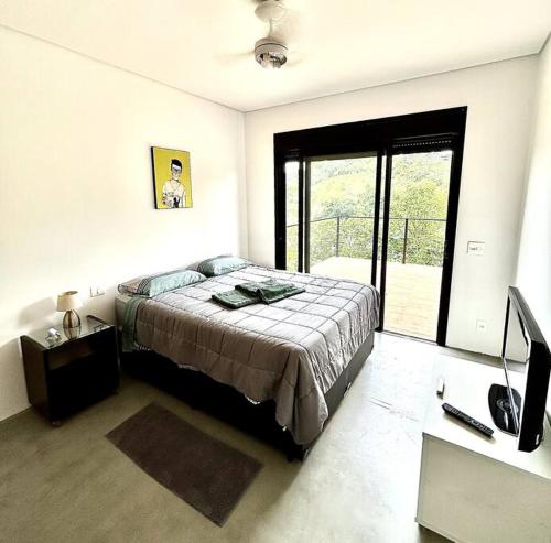 A bed or beds in a room at TRANCADO para locação