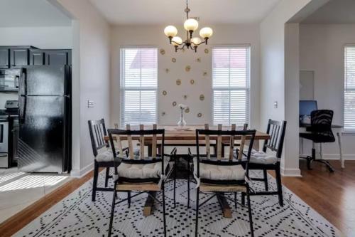 a dining room with a table and chairs at Honey, I’m Home near Savannah - Seen on HGTV in Savannah