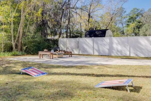 two chairs and a picnic table in the grass at Honey, I’m Home near Savannah - Seen on HGTV in Savannah